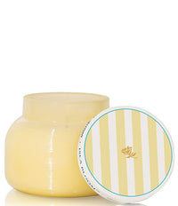 Yellow jar with striped lid on a white background