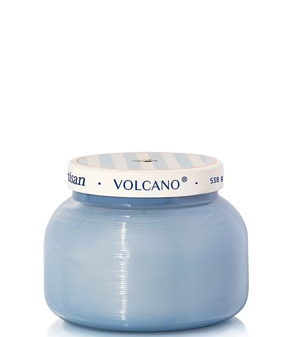 Blue candle jar with 'Volcano' branding on a white background