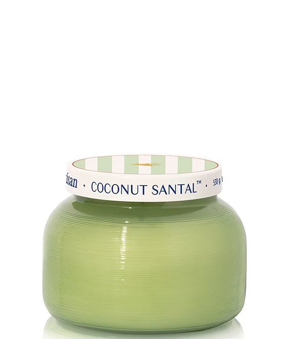 Green candle with a white and green striped lid on a white background