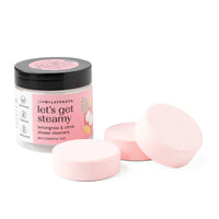 Jar of 'let's get steamy' shower steamers with pink packaging on a white background
