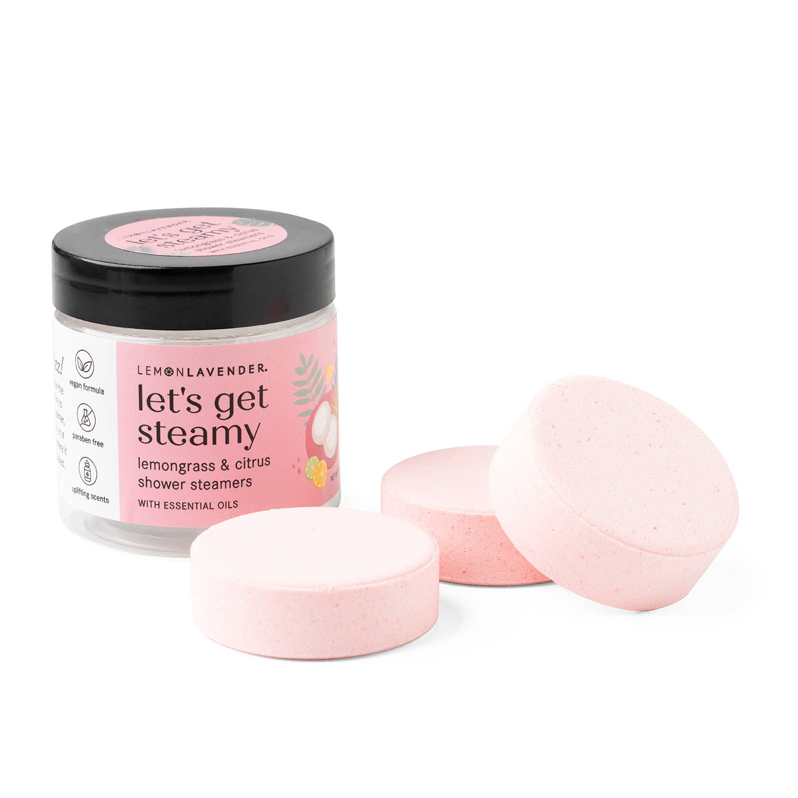 Jar of 'let's get steamy' shower steamers with pink packaging on a white background