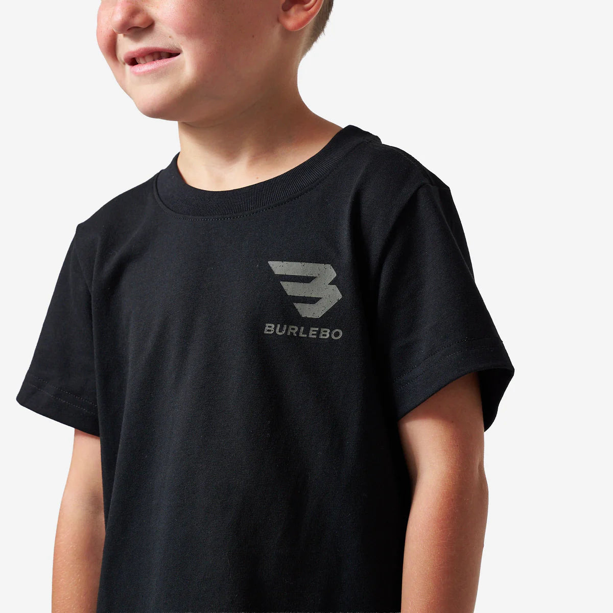 Child wearing a black t-shirt with a logo and text on a white background