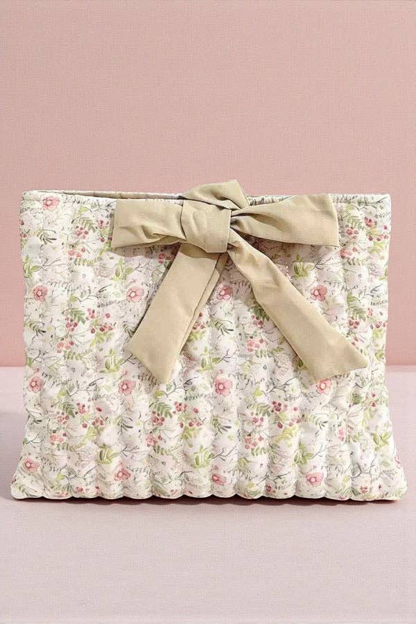 Floral fabric with a bow on a pink background