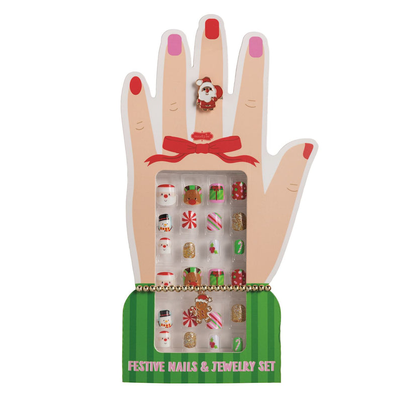 A festive nail set displayed on a hand-shaped stand. The set includes multicolor holiday-themed nail wraps and matching small jewelry pieces, with a green base labeled 'FESTIVE NAILS & JEWELRY SET'.