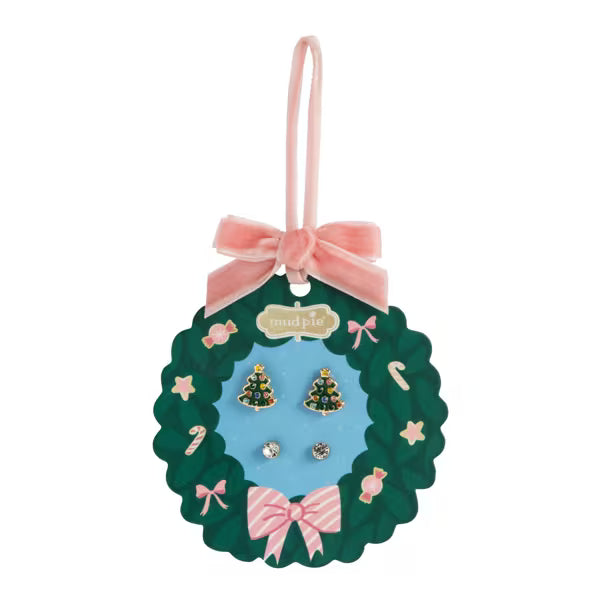 Set of earrings in a decorative packaging with a pink bow on a white background