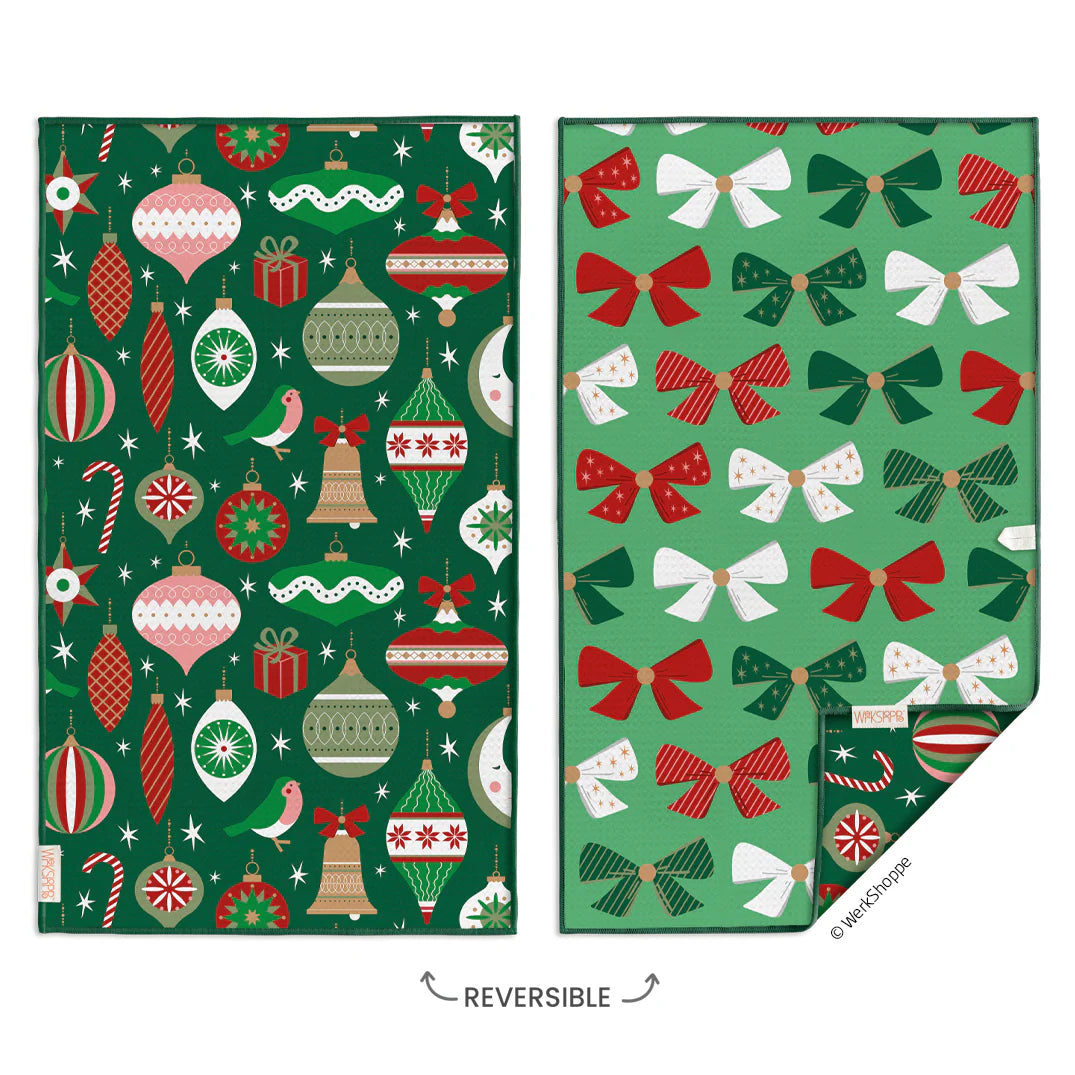 Two green fabric swatches with Christmas-themed patterns on a white background