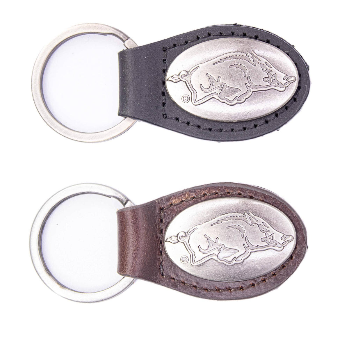 Two keychains with engraved logos on a white background