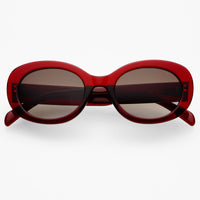 Red sunglasses with dark lenses on a white background