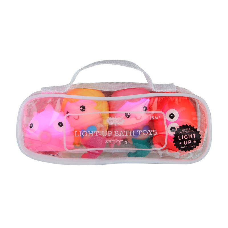 Set of light-up bath toys in a clear plastic case on a white background