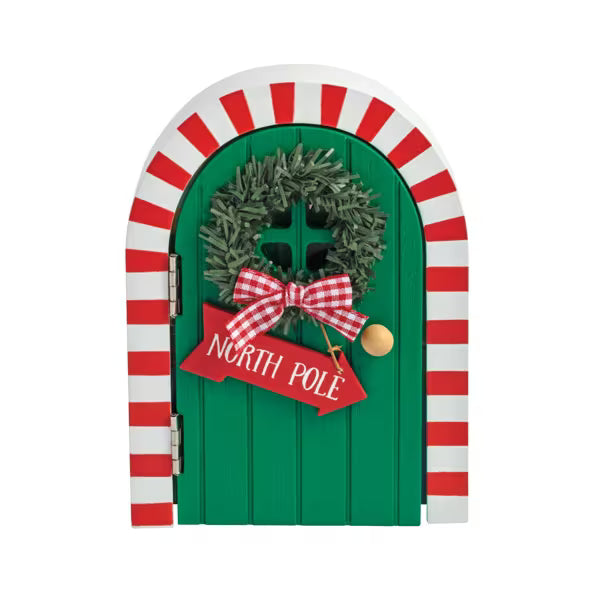 Decorative Christmas door with wreath and 'North Pole' sign on a white background