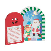 Christmas-themed door with Santa Claus and an elf, featuring a red door and colorful window.