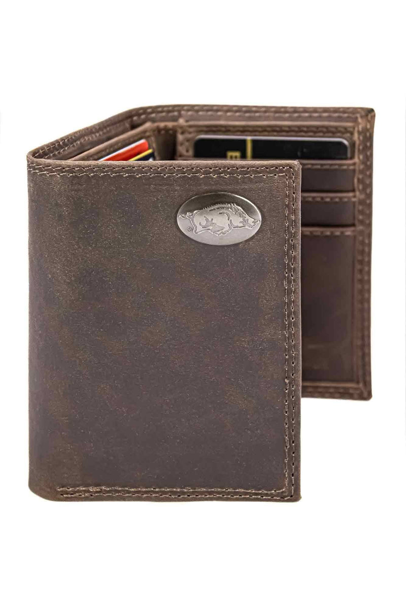 Brown leather wallet with a metallic emblem on a white background