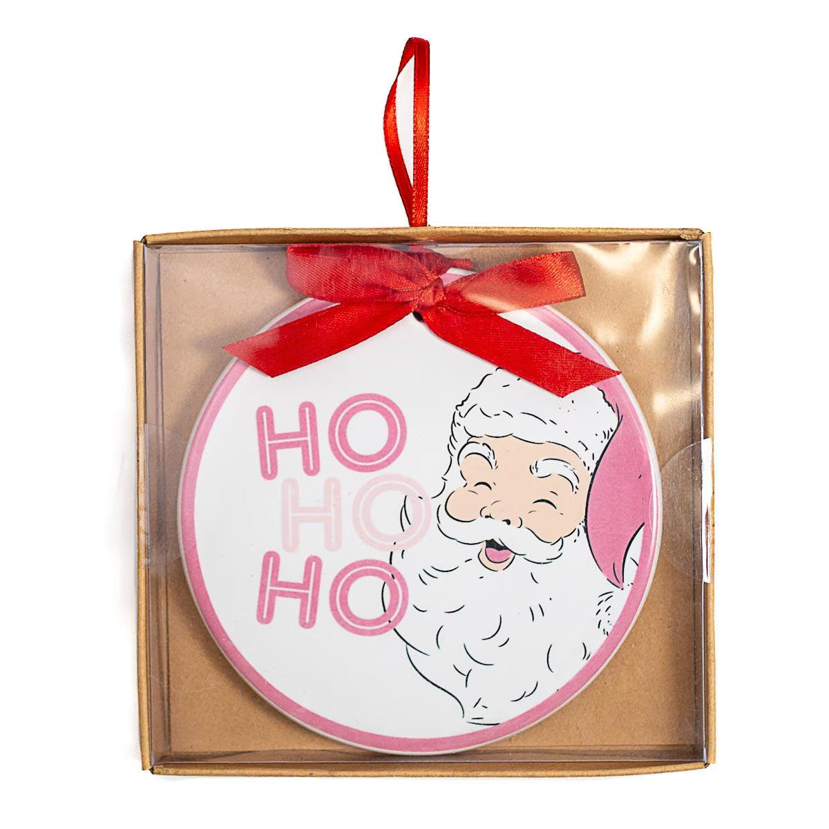 A round Christmas ornament in a clear windowed gift box, featuring a white Santa face with pink outlines, pink 'HO HO HO' lettering, and a red ribbon bow at the top.