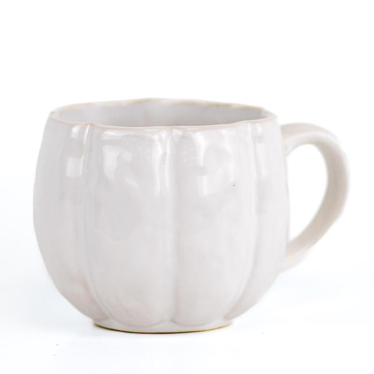 A light beige ceramic mug with a ribbed, pumpkin-like exterior design and a curved handle, shown against a plain white background.