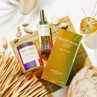 Moodcast Beach Vacay fragrance set with diffuser, bottle, and packaging on a decorative background.