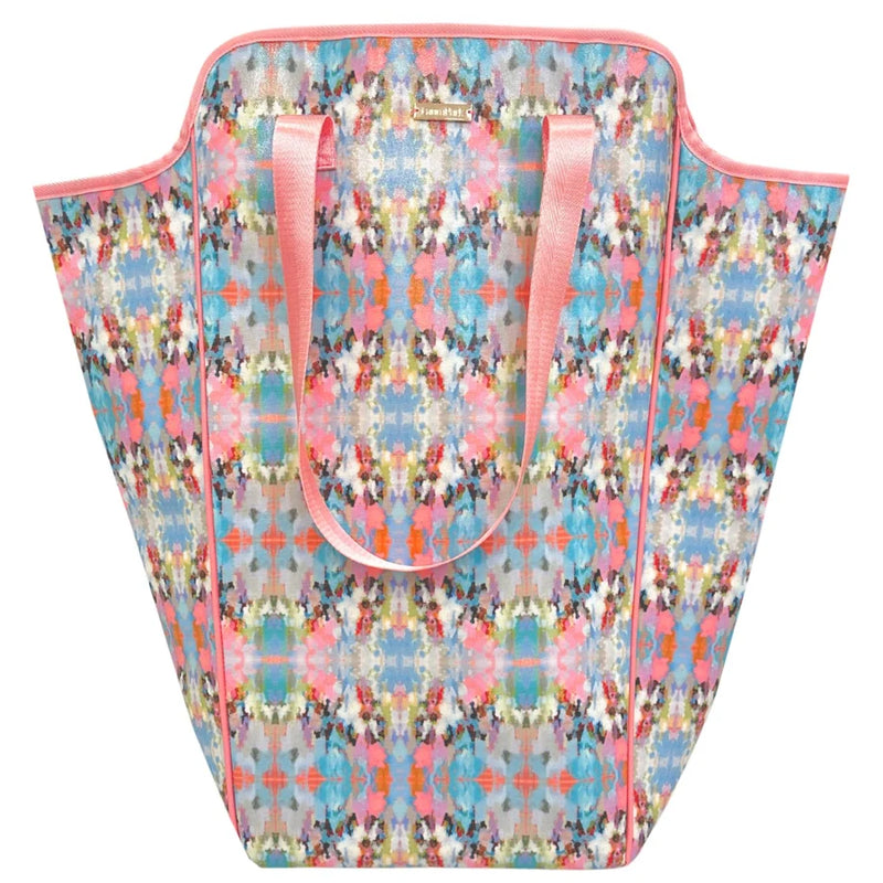 Colorful patterned laundry bag with pink handles on a white background