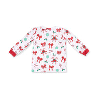 A long-sleeve white pajama top with a festive Christmas print featuring red bows, green holly leaves, candy canes, and snowflakes, finished with solid red cuffs.