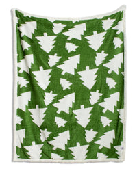 A fleece throw blanket featuring a green and white Christmas tree pattern, finished with a soft white sherpa border.