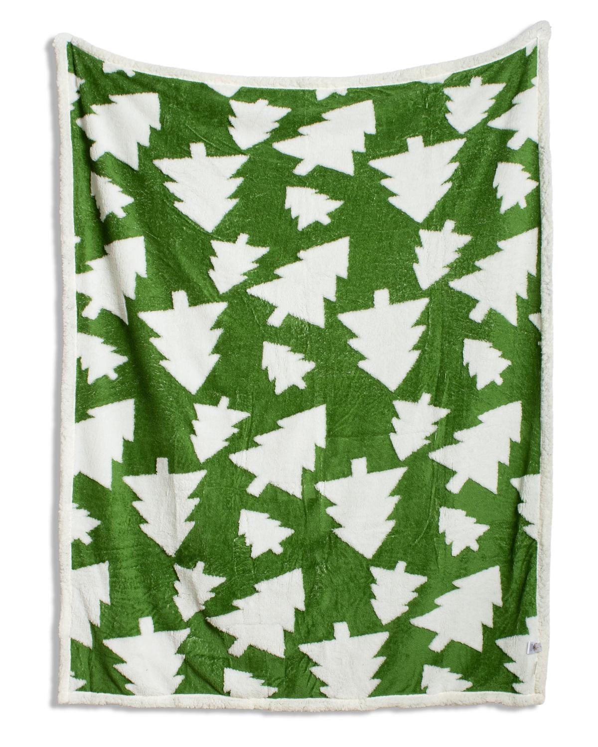 A fleece throw blanket featuring a green and white Christmas tree pattern, finished with a soft white sherpa border.