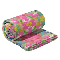 Roll of colorful floral-patterned fabric on a white background