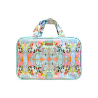 Multicolored patterned bag with a handle on a white background