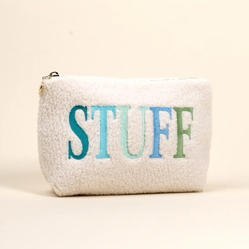 White pouch with 'STUFF' in colorful letters on a beige background