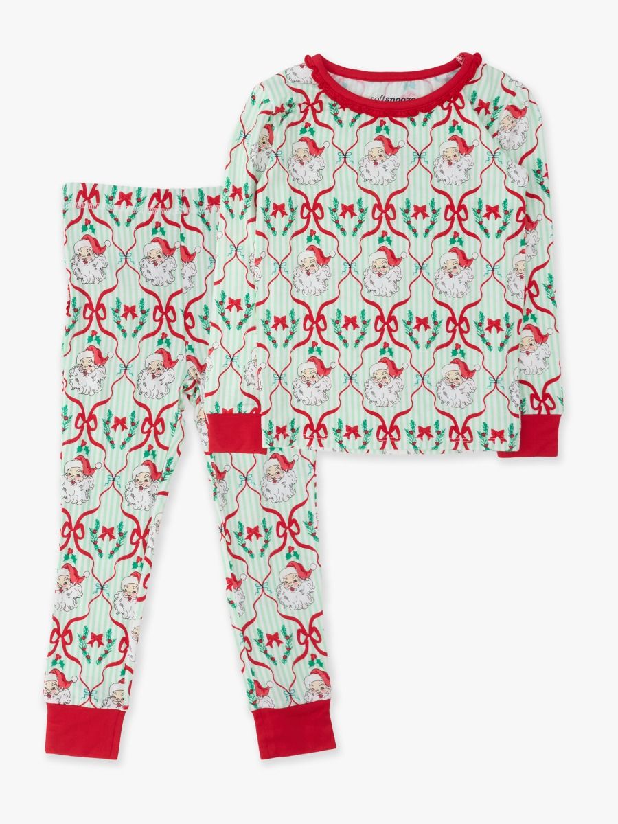 A two-piece Christmas pajama set featuring a long-sleeve top and matching pants. The pajamas have a festive pattern with Santa Claus, red bows, holly, and stars on a pale green and white background, with solid red ribbed trim at the collar, cuffs, and pocket openings.