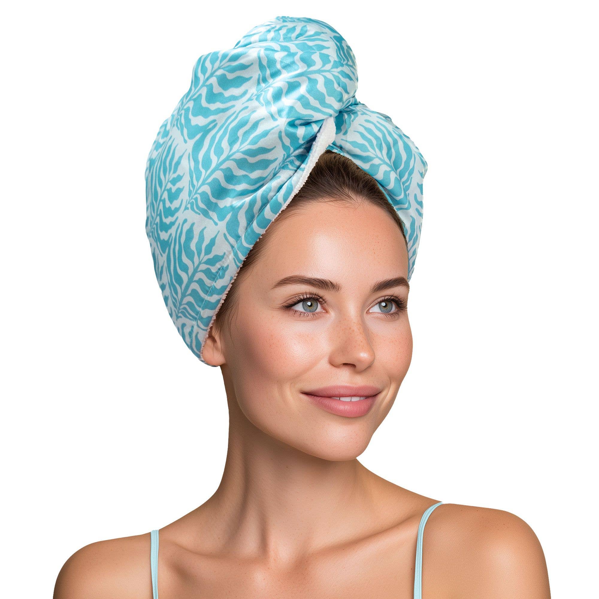 Woman wearing a blue patterned hair towel on a white background