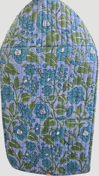 Floral-patterned ironing board cover with blue and green colors on a white background
