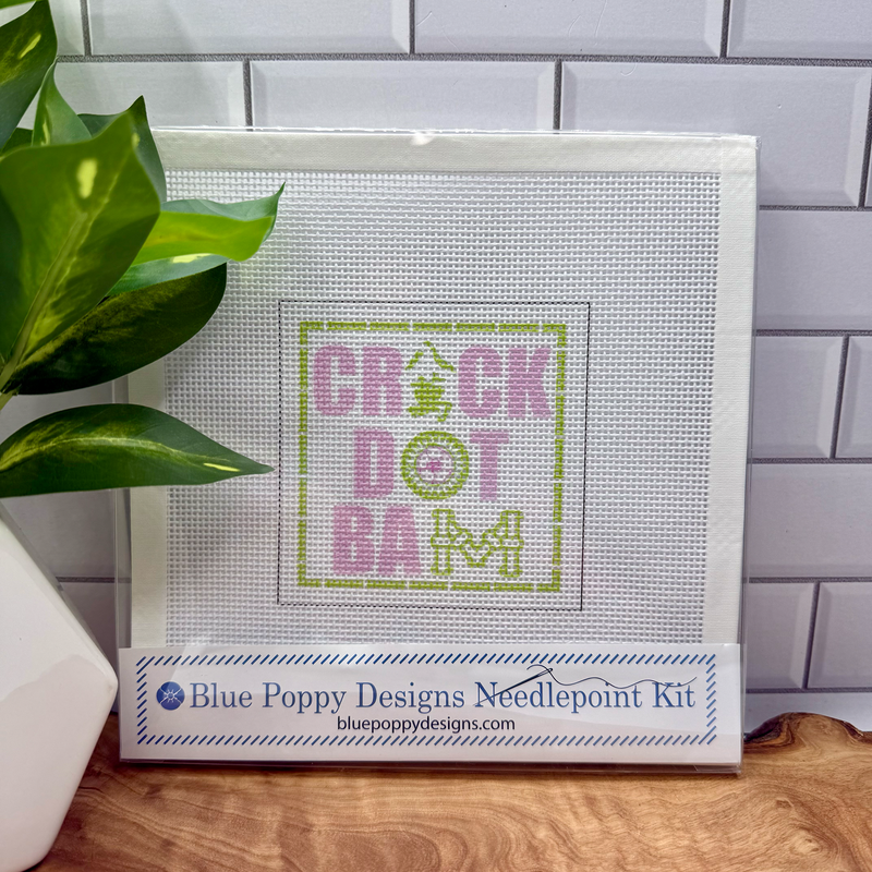 Cross-stitch kit with 'CRACK DOT BAM' design on a white background, featuring Blue Poppy Designs branding.