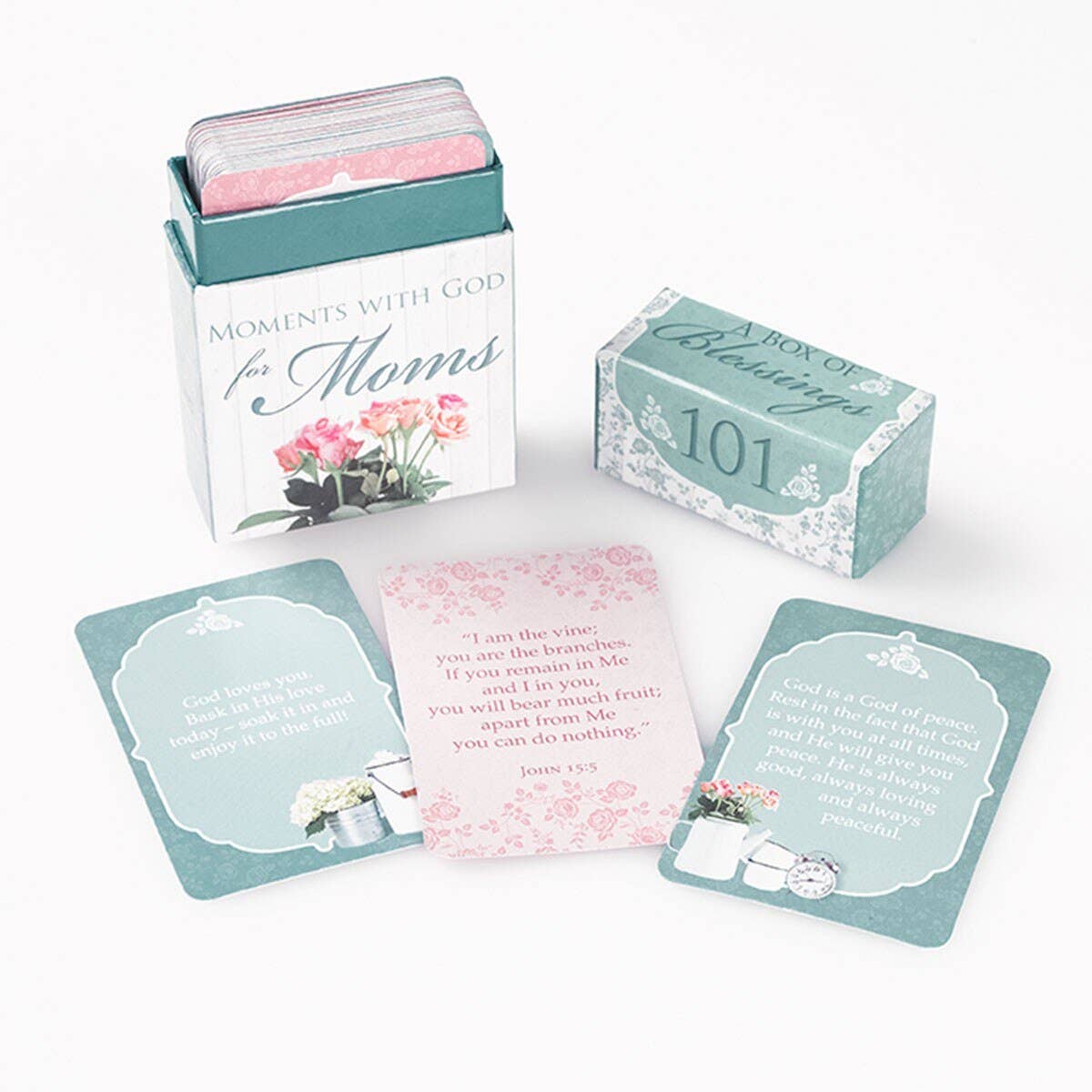 Set of cards with inspirational messages in a decorative box on a white background