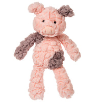 Plush toy pig with pink body and brown accents on a white background