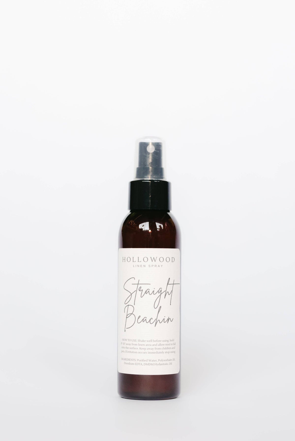 Brown spray bottle labeled 'Straight Beach' on a white background