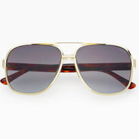 Aviator sunglasses with gold frame and dark lenses on a white background