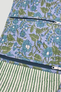Floral and striped fabric with zippers on a white background