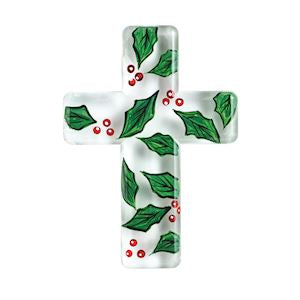 A white cross-shaped decorative plaque or wall piece featuring a green holly leaf and red berry pattern, shown on a plain white background.