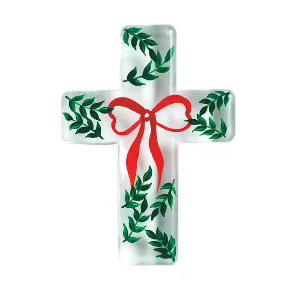 Decorative cross with a red bow and green leaves on a white background