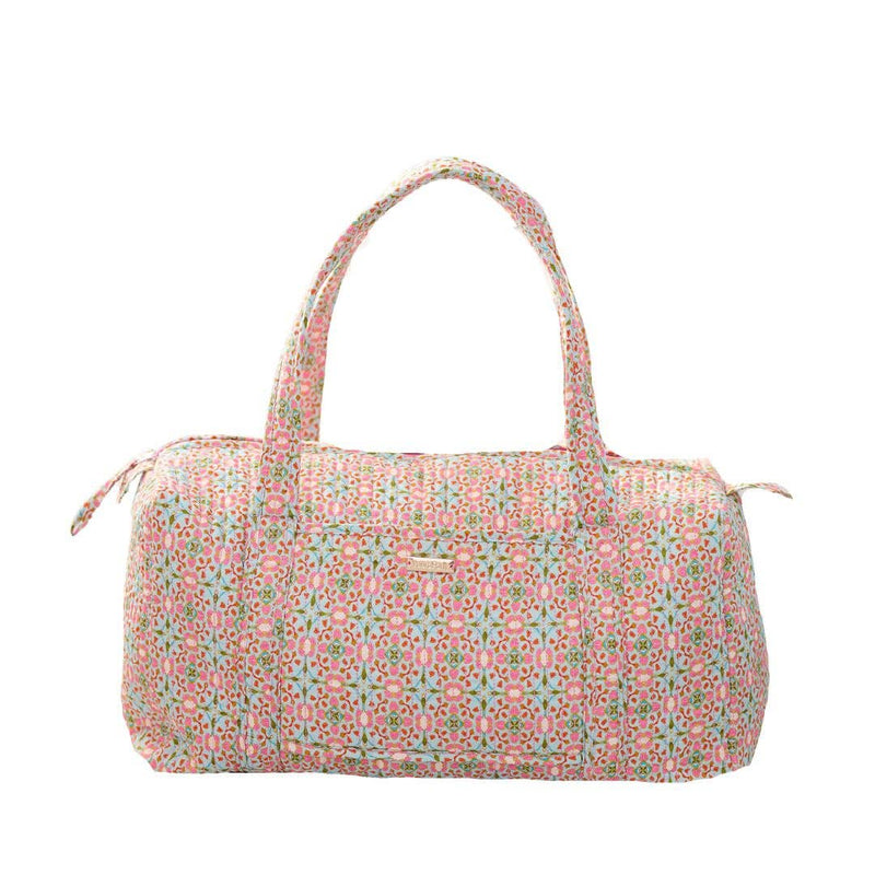 Floral patterned duffel bag on a white background