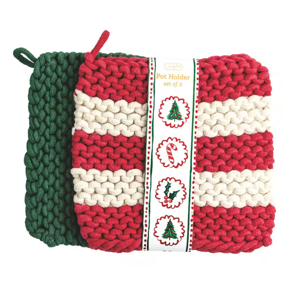 Three chunky-knit Christmas-themed pot holders in red, cream, and dark green, wrapped together with a decorative paper band that reads 'Pot Holder set of 3' and shows holiday illustrations.