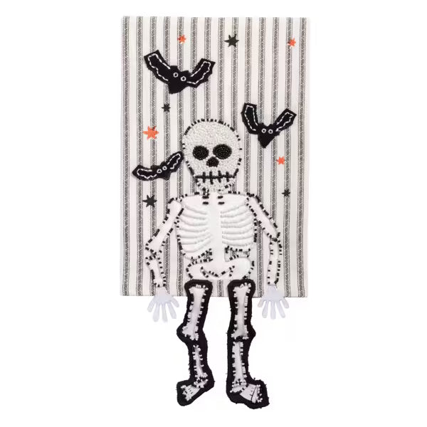Decorative towel with a skeleton design on a striped background