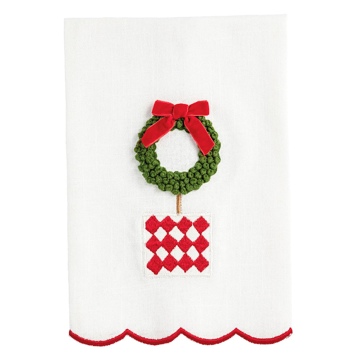 Decorative towel with a green wreath and red bow on a white background