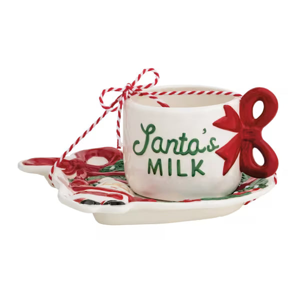Decorative set with a cup labeled 'Santa's Milk' on a white background