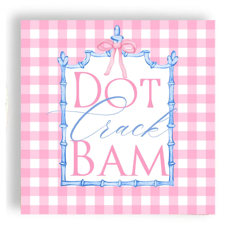 Decorative sign with 'Dot Crack BAM' text on a pink and white checkered background