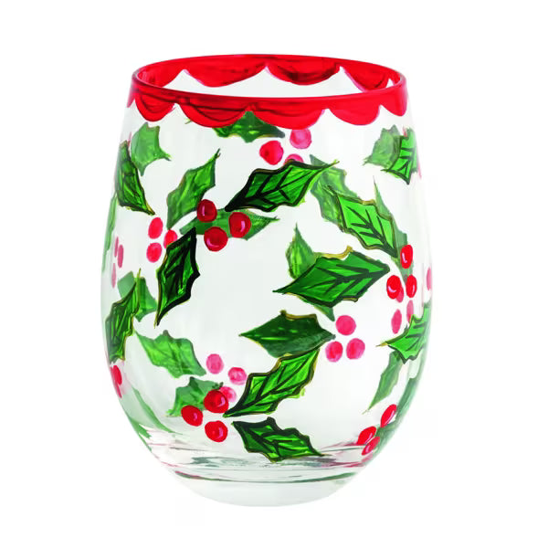 A clear stemless wine glass decorated with a festive holly pattern featuring green leaves, red berries, and a scalloped red rim, shown against a plain white background.