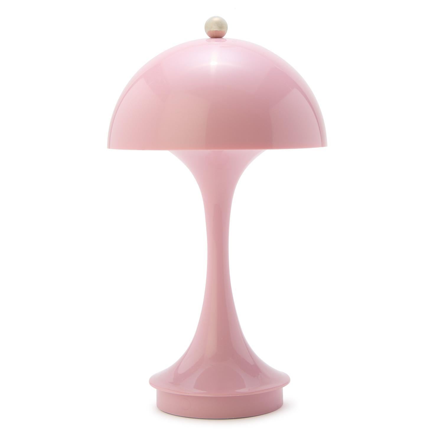 Pink table lamp on a white background