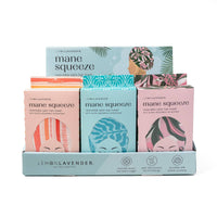 Mane Squeeze reversible satin hair towel packaging with colorful designs on a white background
