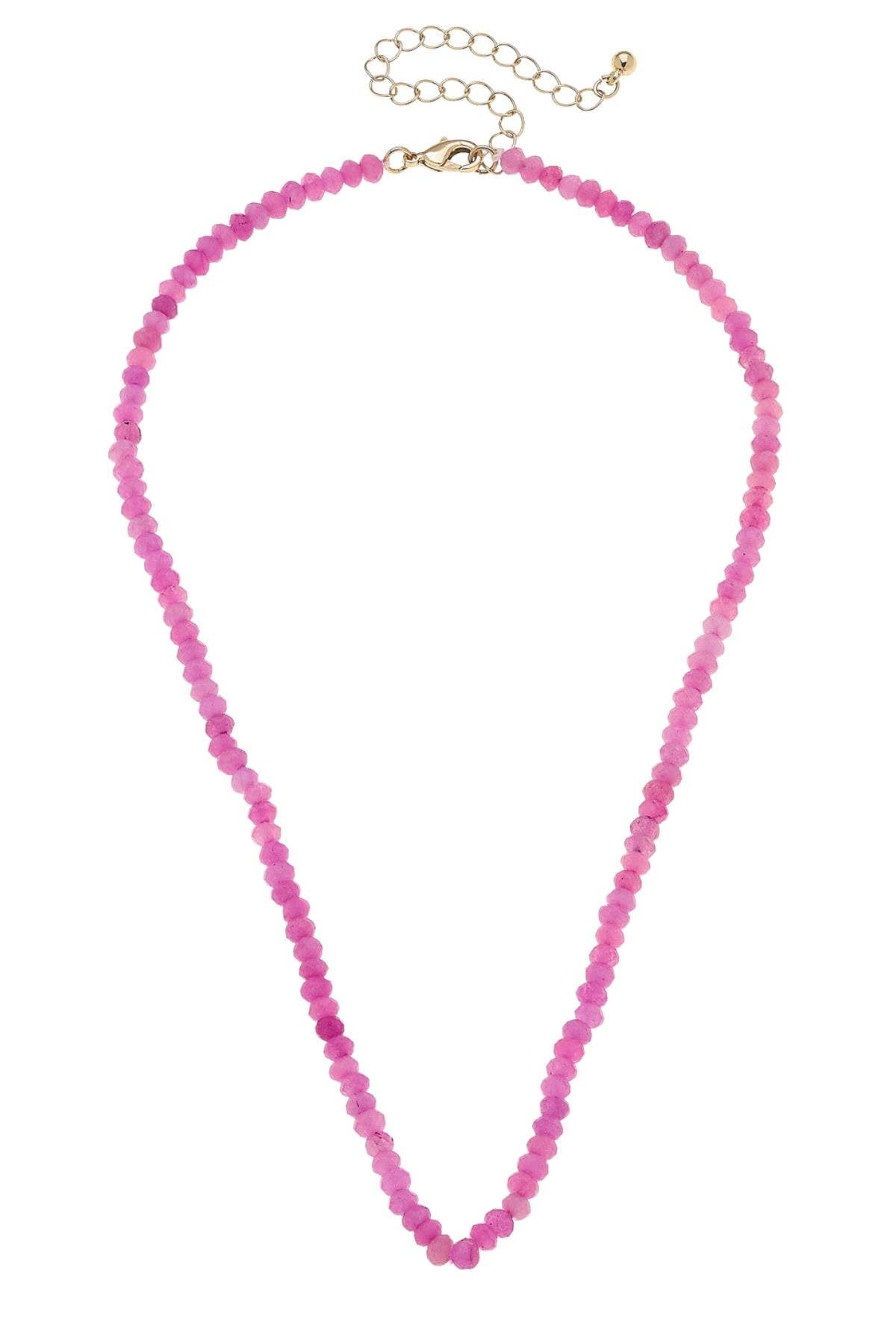 Pink beaded necklace on a white background