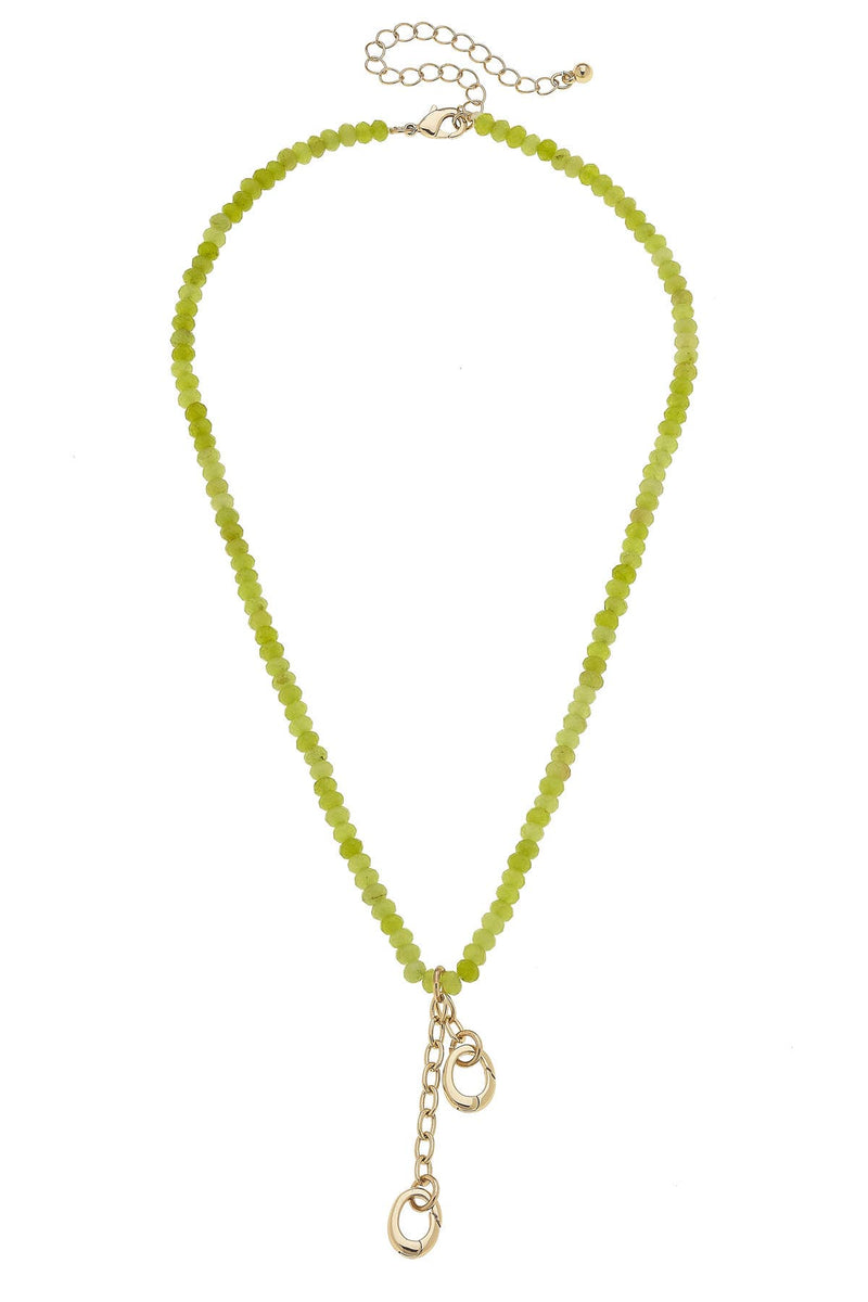 Green beaded necklace with a gold clasp on a white background