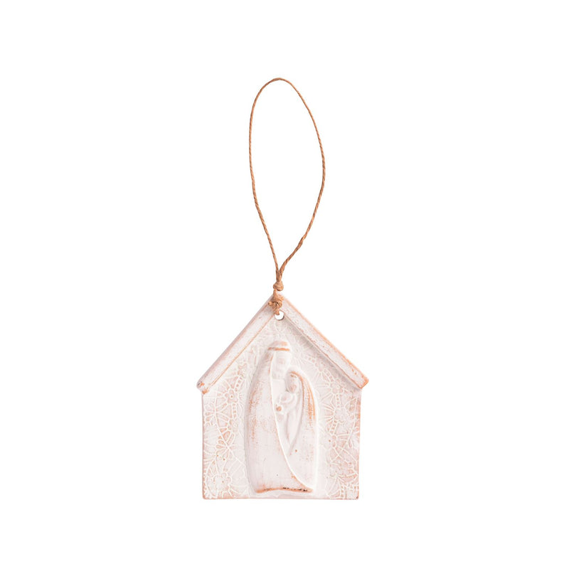 Decorative house-shaped ornament with a string on a white background