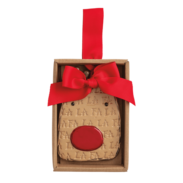 A Christmas ornament shaped like a reindeer face, displayed inside its brown cardboard gift box with a red ribbon bow and hanging loop. The ornament has a light beige face patterned with the word 'FALLA' and a bright red snout.